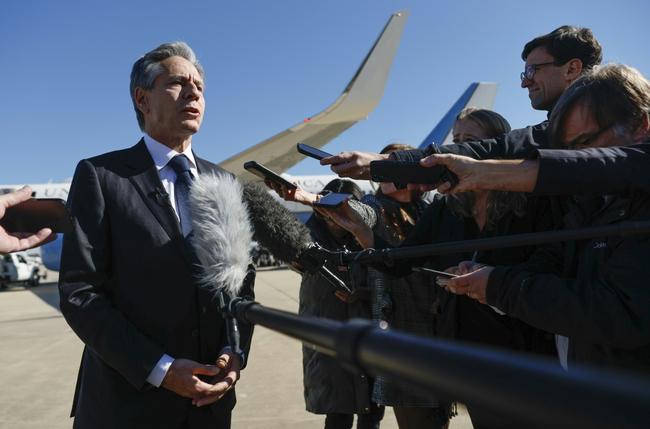 US Secretary of State Antony Blinken talks to reporters prior to boarding his aircraft at Joint Base Andrews on his way to the Middle East and Asia