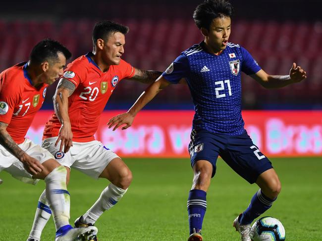 Japan's Takefusa Kubo on the ball against Chile.