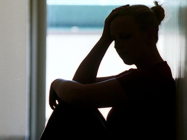 21 Dec 2001 Silhouette of young woman seated in doorway, date rape victim in Adelaide. Sexual Assault crime sa sex generic