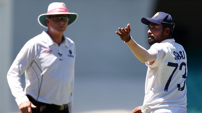 Mohammed Siraj alerts umpire Paul Reiffel to the abuse coming from the SCG stands. Picture: Cameron Spencer/Getty Images