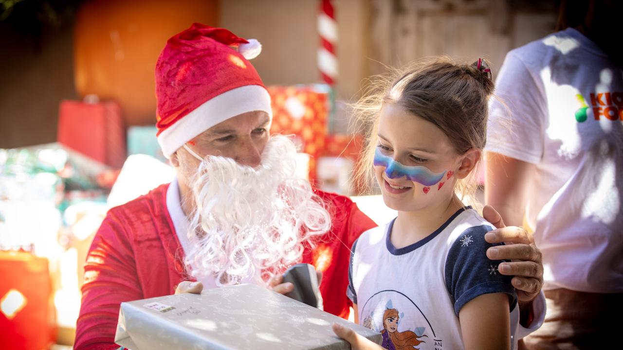 Dan Demaria as Santa, hands out Christmas presents at KickStart For Kids Christmas Party hosted by Bird In Hand Winery in Woodside, SA. Picture: Emma Brasier