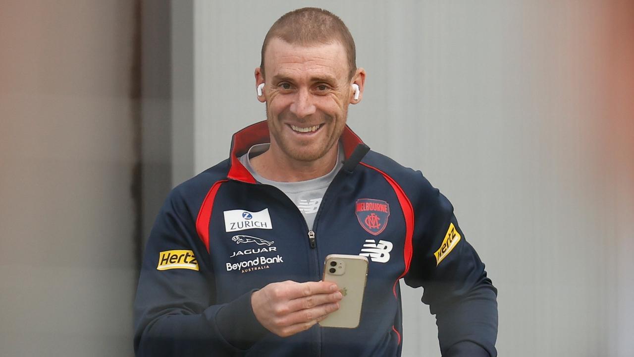 PERTH, AUSTRALIA - SEPTEMBER 18: Simon Goodwin, Senior Coach of the Demons takes a call during the Melbourne Demons training session at Lathlain Park on September 18, 2021 in Perth, Australia. (Photo by Michael Willson/AFL Photos via Getty Images)