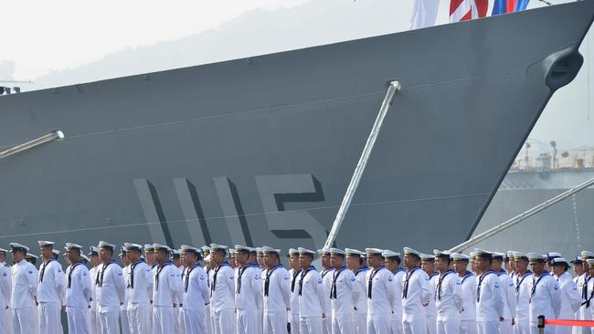 Taiwan sailors parade in front of the 'Feng Chia' (1115) navy frigate. Picture: AFP.