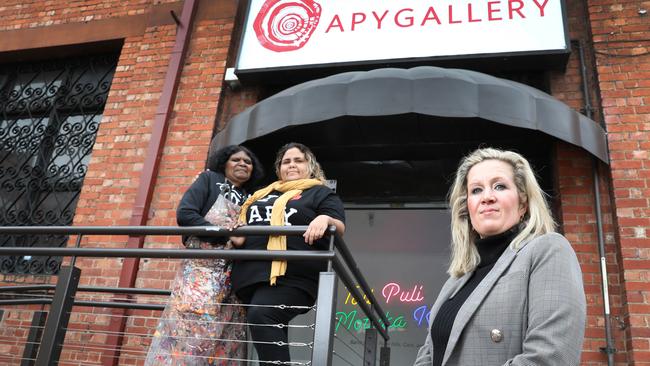 Skye O’Meara with artist Rhoda Tjitayi (left), and Sally Scales outside the art gallery in Adelaide. Picture Dean Martin