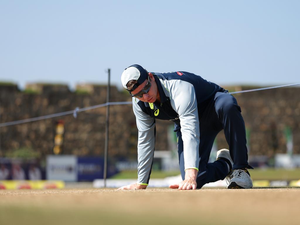 Steve Smith, pictured inspecting the pitch, said Australia would not finalise its XI until the morning of day one. Picture: Getty Images