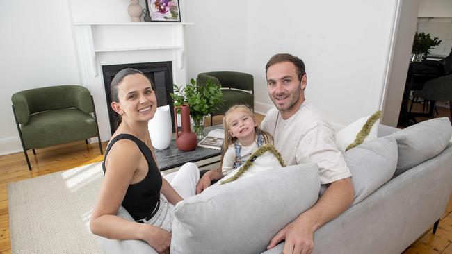 Kellie and Jeremy Finlayson with their daughter Sophia, 3, inside the Hendon home they are selling. Picture: Mark Brake