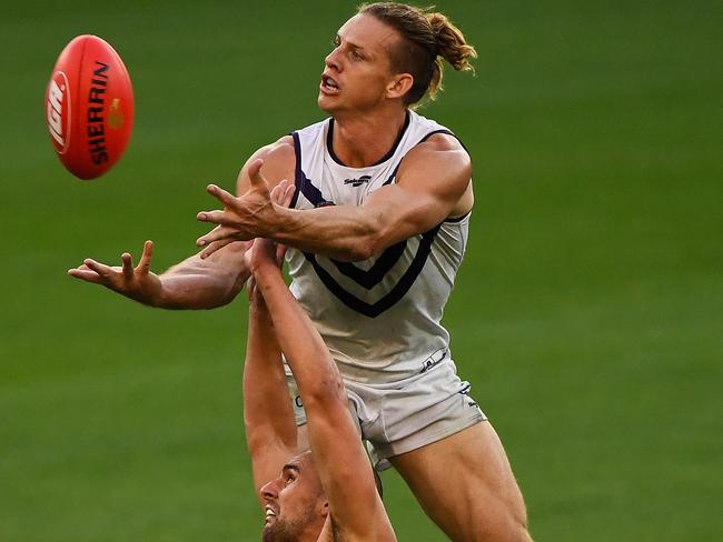 Nat Fyfe rises for a mark.