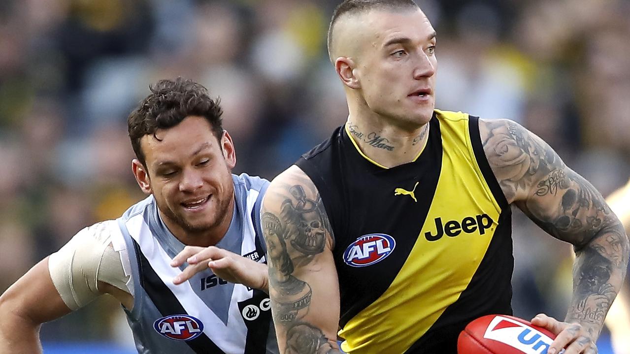 MELBOURNE, AUSTRALIA - JULY 20: Dustin Martin of the Tigers in action ahead of Steven Motlop of the Power during the 2019 AFL round 18 match between the Richmond Tigers and the Port Adelaide Power at the Melbourne Cricket Ground on July 20, 2019 in Melbourne, Australia. (Photo by Dylan Burns/AFL Photos)