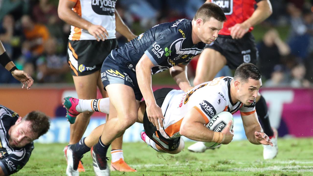 Ryan Matterson of the Tigers is tackled by Tom Opacic of the Cowboys during the Round 14 NRL match between the North Queensland Cowboys and the Wests Tigers at 1300SMILES Stadium in Townsville, Friday June 14, 2019. (AAP Image/Michael Chambers) NO ARCHIVING, EDITORIAL USE ONLY