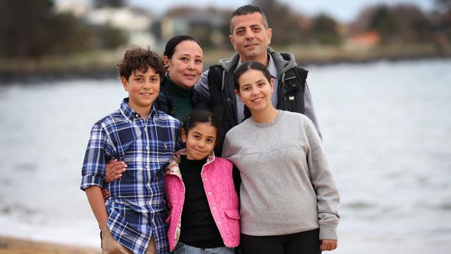 Weekend story about a dad Peter Ghobrial who inadvertently saved his own life while rescuing his daughter Natalie 14 from drowning at a Sorrento beach, after the frantic swim exposed a silent heart issue that would have likely killed him. Peter Ghobrial with wife Fiby, son Giovanni 12, daughters Celina 8 and Natalie 14.                                                               Picture: David Caird