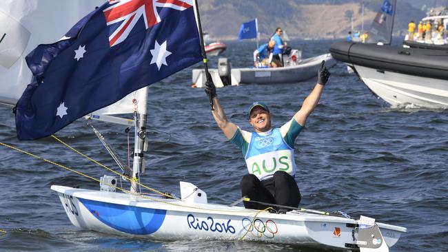 Australia's Tom Burton celebrates after winning the Laser medal race.