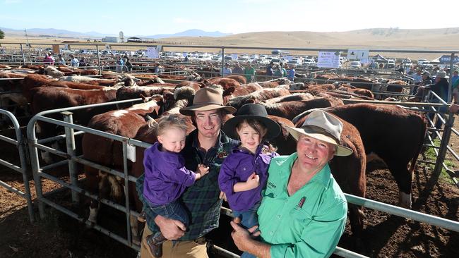 Brandon &amp; Donald Betts, with their kids Willow, 1, and Ava, 3, with their cattle at Hunnomunjie. Picture: Yuri Kouzmin