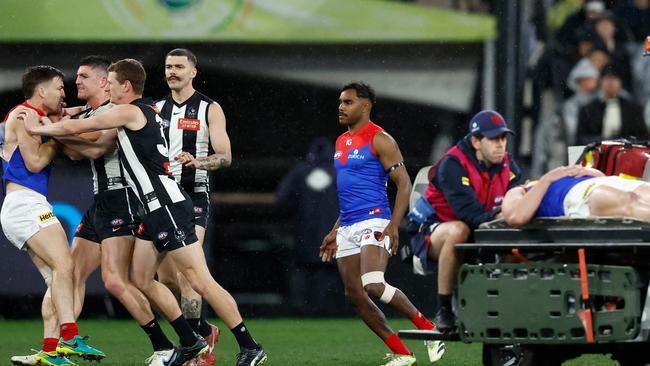 Brayden Maynard and Jack Viney clash as Angus Brayshaw leaves the field on a stretcher. (Photo by Michael Willson/AFL Photos via Getty Images)