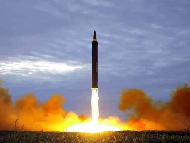 (FILES) This file photo from North Korea's official Korean Central News Agency (KCNA) taken on August 29, 2017 and released on August 30, 2017 shows North Korea's intermediate-range strategic ballistic rocket Hwasong-12 lifting off from the launching pad at an undisclosed location near Pyongyang. Nuclear-armed North Korea's testing of long-range missiles that could possibly reach US soil has kindled debate in Japan and South Korea about developing their own nuclear deterrent, prompting fears of a North East Asian arms race. / AFP PHOTO / KCNA VIA KNS / STR / South Korea OUT / REPUBLIC OF KOREA OUT   ---EDITORS NOTE--- RESTRICTED TO EDITORIAL USE - MANDATORY CREDIT "AFP PHOTO/KCNA VIA KNS" - NO MARKETING NO ADVERTISING CAMPAIGNS - DISTRIBUTED AS A SERVICE TO CLIENTS THIS PICTURE WAS MADE AVAILABLE BY A THIRD PARTY. AFP CAN NOT INDEPENDENTLY VERIFY THE AUTHENTICITY, LOCATION, DATE AND CONTENT OF THIS IMAGE. THIS PHOTO IS DISTRIBUTED EXACTLY AS RECEIVED BY AFP.   TO GO WITH NKorea-nucelar-missile-Japan-SKorea-politics, FOCUS by Shingo Ito and Park Chan-Kyong /