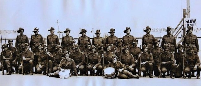 A new intake of South Australian AIF infantrymen photographed at Wayville shortly before deployment to the 2/27th Battalion in the Middle East. Ed is the 6th squatting soldier from the right.