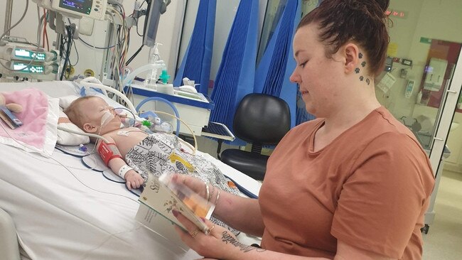 Tiffani Buddee by her daughter’s bedside at the Queensland Children’s Hospital. Picture: Supplied.