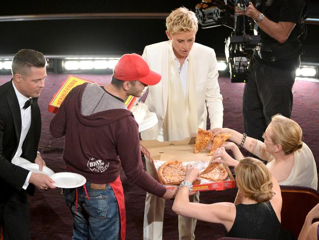 Host Ellen DeGeneres with actor Brad Pitt and actress Meryl Streep in the audience during the Oscars at the Dolby Theatre on March 2, 2014 in Hollywood, California. (Photo by Kevin Winter/Getty Images)