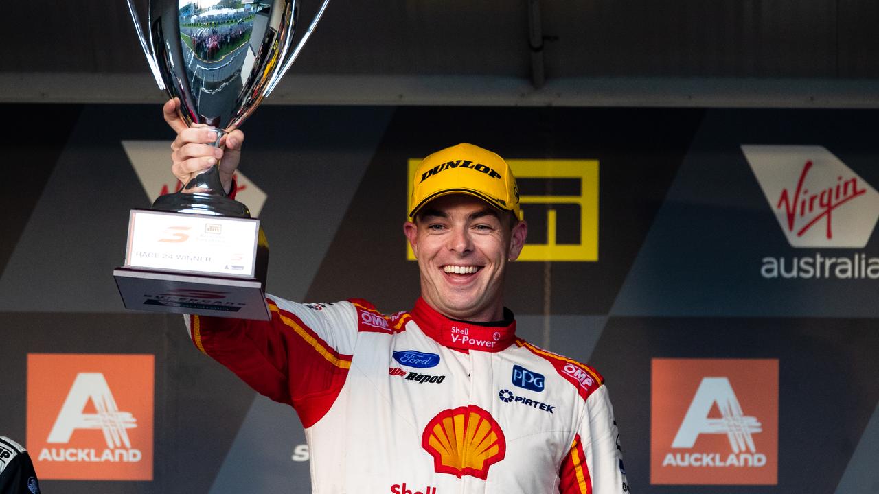 Scott McLaughlin celebrates on the podium after Race 24 at Pukekohe.