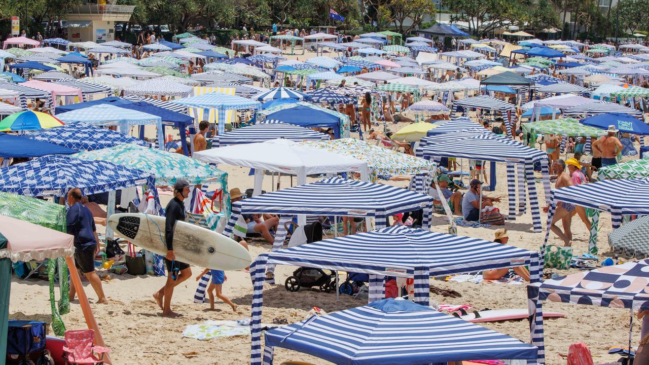 Crowds pack in to Noosa Main Beach on the New Year’s Day public holiday. Picture Lachie Millard