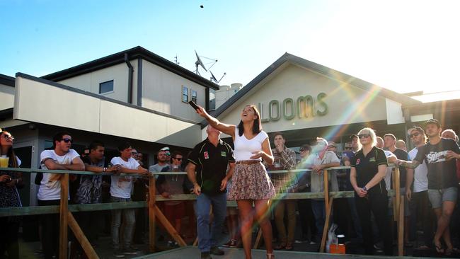 Pub-goers enjoy a game of two-up at The Bradford Hotel on Anzac Day.