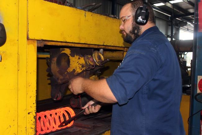 Nick Dobinson manufactures a coil spring, the core business of the family-run Dobinsons business.Photo Amber Hooker / The Morning Bulletin. Picture: Amber Hooker