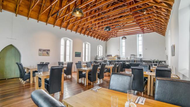 The renovated interior of the church turned restaurant. Pic: RAY WHITE HOBART