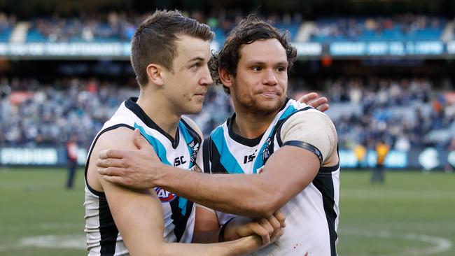 Power players Jack Trengove and Steven Motlop after their win at the MCG. Picture: Adam Trafford/AFL Media/Getty Images