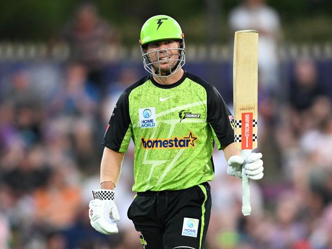 David Warner raises the bat after scoring a half century. Picture: Getty Images