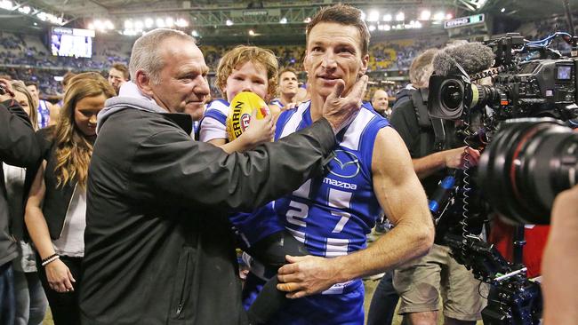 Brent Harvey and his father Neil after the Kangaroos legend’s record-breaking game.