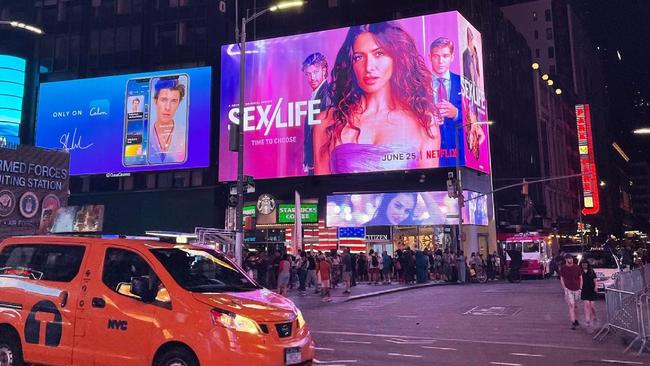 The Sex/Life billboard lights up in Times Square.