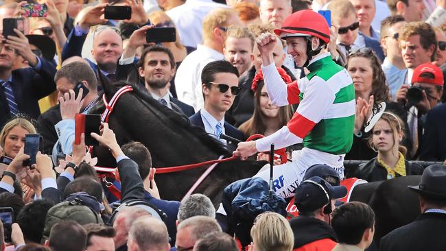 Damian Lane celebrates with the Valley crowd after winning last year’s Cox Plate on Lys Gracieux. Picture: Getty Images