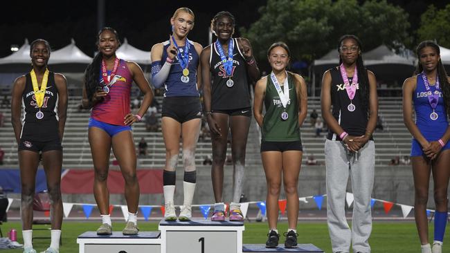 AB Hernandez on the first-place step with Kira Gant Hatcher. Photo: AP Photo/Jae C. Hong