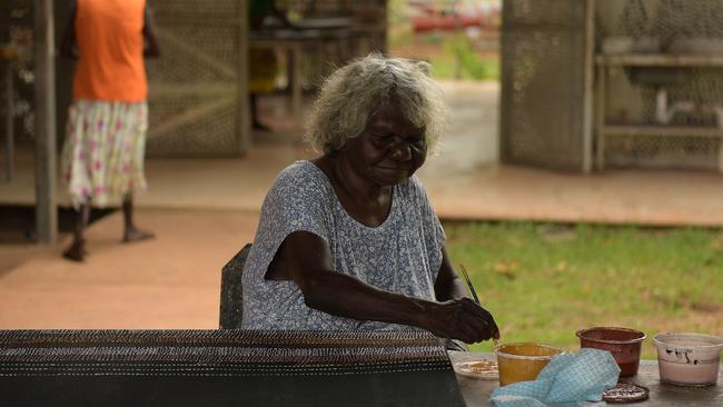 Artist paints at Pirlangimpi Art Centre. Picture: (A)manda Parkinson