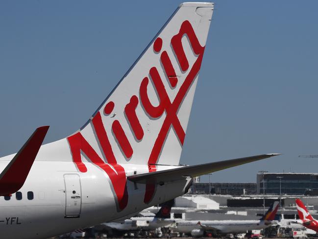 A Virgin Australia plane is seen at Sydney Airport, Wednesday February 28, 2018. Virgin Australia's board has decided against delisting the airline from the ASX following discussions with major shareholders. (AAP Image/Peter Rae) NO ARCHIVING