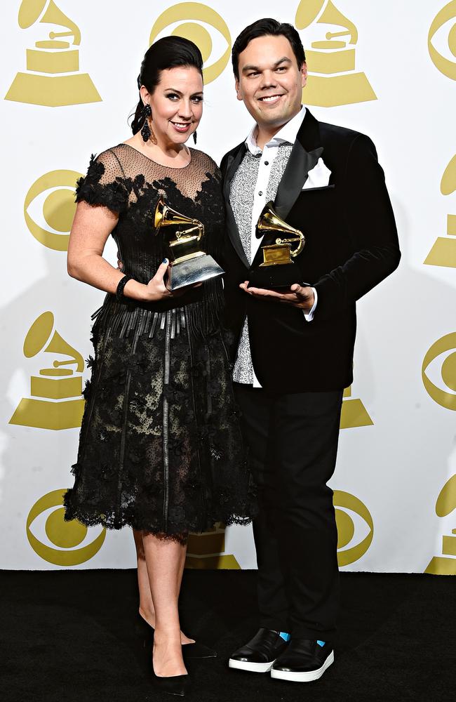 Songwriting team Kristen Anderson-Lopez and Robert Lopez with one of many awards.