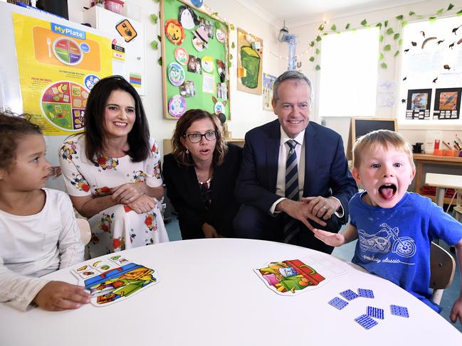 Lucas, 4 (right) reacts as he sits with Labor Candidate for Dickson Ali France (left), Shadow Minister for Early Childhood Education Amanda Rishworth (centre) and Leader of the Opposition Bill Shorten at the Goodstart Early Learning Centre at Albany Creek in Brisbane, Wednesday, October 3, 2018. Mr Shorten used the visit to discuss Prime Minister Scott Morrison's $440 million cut to preschool funding. (AAP Image/Dave Hunt) NO ARCHIVING