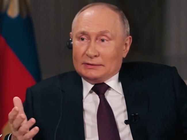 Vladimir Putin gestures to Tucker Carlson during the interview. Picture: Supplied