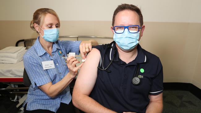 Associate Professor Paul Griffin, an infectious disease expert, getting his AstraZeneca vaccine at the Mater Hospital. Pic Annette Dew