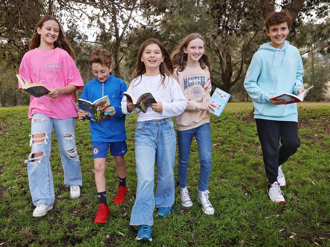 A new University of Queensland study has found a link between a lack of greenery within 500m of a home and below average reading, writing, grammar and punctuation in NAPLAN tests in kids in Years 3 and 5. Keeping the spelling scene green from left to right are Maeve Sullivan, Finlay Pogson, Bodhi Tobin, Violet Sullivan and Anton Andrews. Picture: Sam Ruttyn