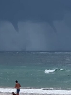 Twin Water spouts captured on film off Rainbow Beach on March 30, 2021. Photo courtesy of Higgins Storm Chasers video screenshot.