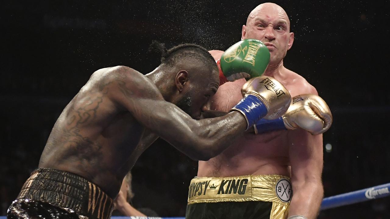 Deontay Wilder connects with Tyson Fury during their heavyweight title fight. (AP Photo/Mark J. Terrill)