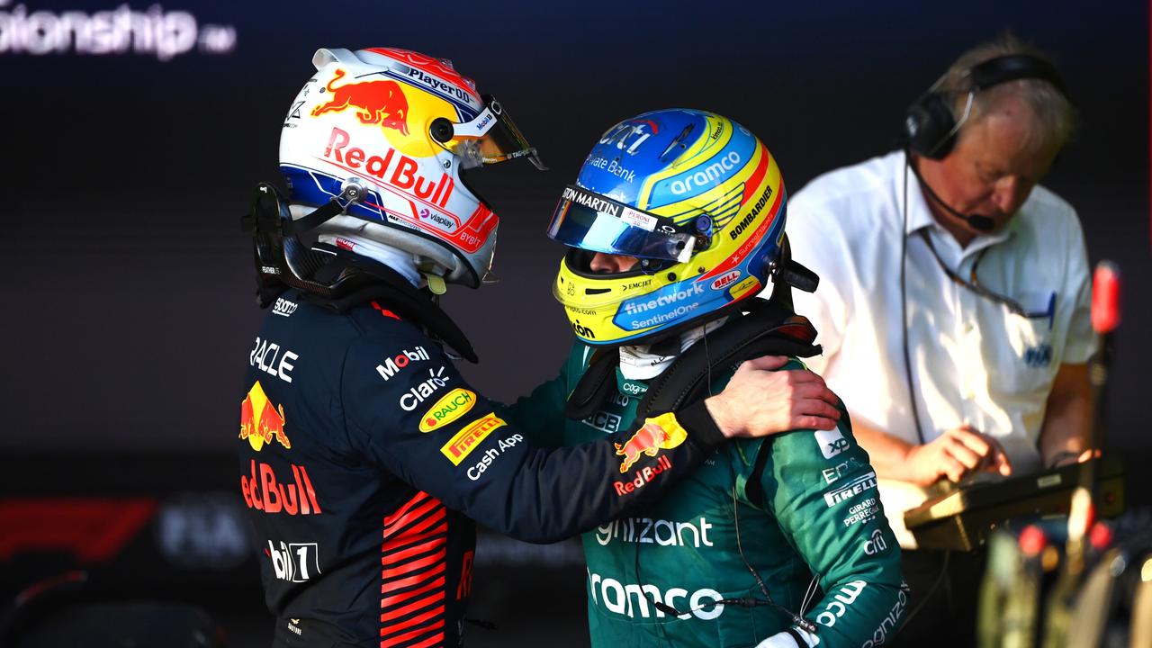MELBOURNE, AUSTRALIA - APRIL 02: Race winner Max Verstappen of the Netherlands and Oracle Red Bull Racing and Third placed Fernando Alonso of Spain and Aston Martin F1 Team celebrate in parc ferme during the F1 Grand Prix of Australia at Albert Park Grand Prix Circuit on April 02, 2023 in Melbourne, Australia. (Photo by Quinn Rooney/Getty Images)