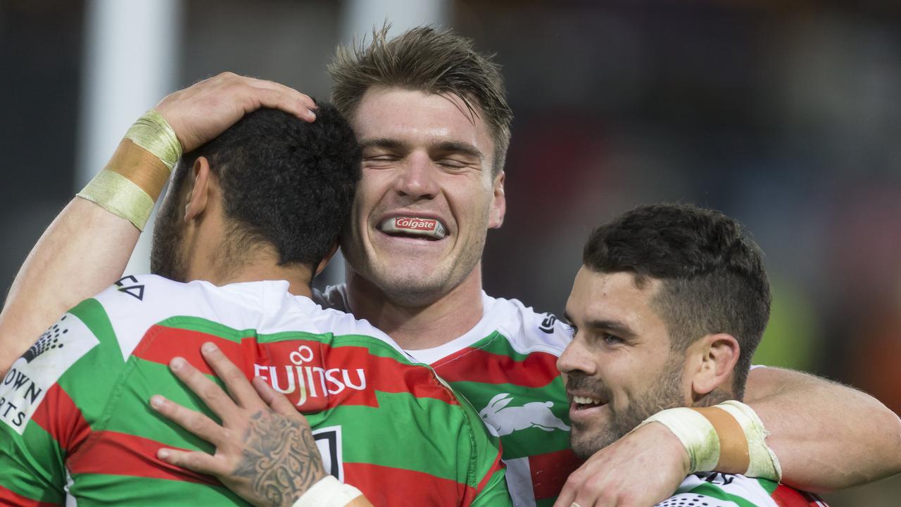 Alex Johnston of the Rabbitohs scores and celebrates with Angus Crichton and Adam Reynolds.