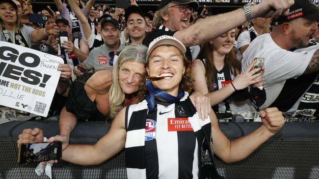 MELBOURNE, AUSTRALIA - SEPTEMBER 30: Jack Ginnivan of the Magpies poses with his Premiership Medal after the 2023 AFL Grand Final match between Collingwood Magpies and Brisbane Lions at Melbourne Cricket Ground, on September 30, 2023, in Melbourne, Australia. (Photo by Darrian Traynor/AFL Photos/via Getty Images)