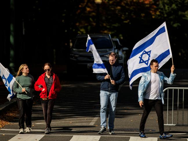 Pro Israel demonstrators carry Israeli flags as they walk towards a pro-Israel rally outside of Israeli Embassy in Washington, DC. Picture: Getty Images via AFP