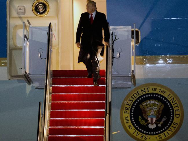 President Donald Trump walks down the stairs of Air Force One upon arrival at Andrews Air Force Base. Picture: AP