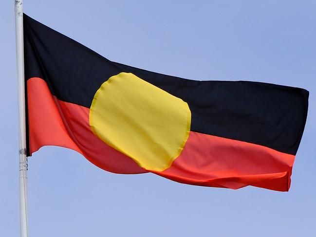 MELBOURNE, AUSTRALIA - NewsWire Photos JANUARY, 15, 2023: Th Aboriginal flag is seen at the Victorian Parliament building.Picture: NCA NewsWire / Luis Enrique Ascui