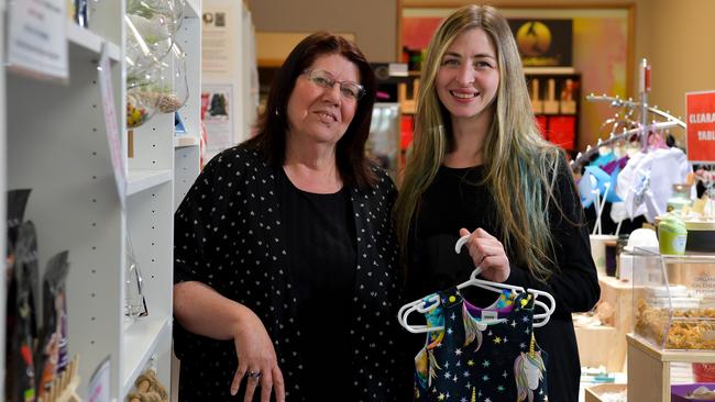 Ann Kakongata'a of Bloomin' Bowls Home Decor and Magdalena Brown holding her Hey Bunny Original baby clothing, sell their wares out of The Market Place in Blackwood. Picture: AAP/ Morgan Sette