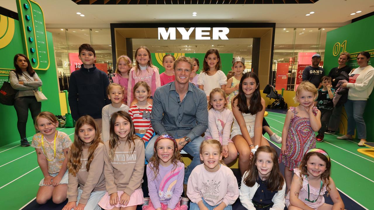 Kids pose for a photo with Cody Simpson at a meet-and-greet at Robina Town Centre outside Myer . Picture Glenn Hampson