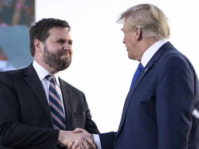 DELAWARE, OH - APRIL 23: (L-R) J.D. Vance, a Republican candidate for U.S. Senate in Ohio, shakes hands with former President Donald Trump during a rally hosted by the former president at the Delaware County Fairgrounds on April 23, 2022 in Delaware, Ohio. Last week, Trump announced his endorsement of J.D. Vance in the Ohio Republican Senate primary.   Drew Angerer/Getty Images/AFP == FOR NEWSPAPERS, INTERNET, TELCOS & TELEVISION USE ONLY ==